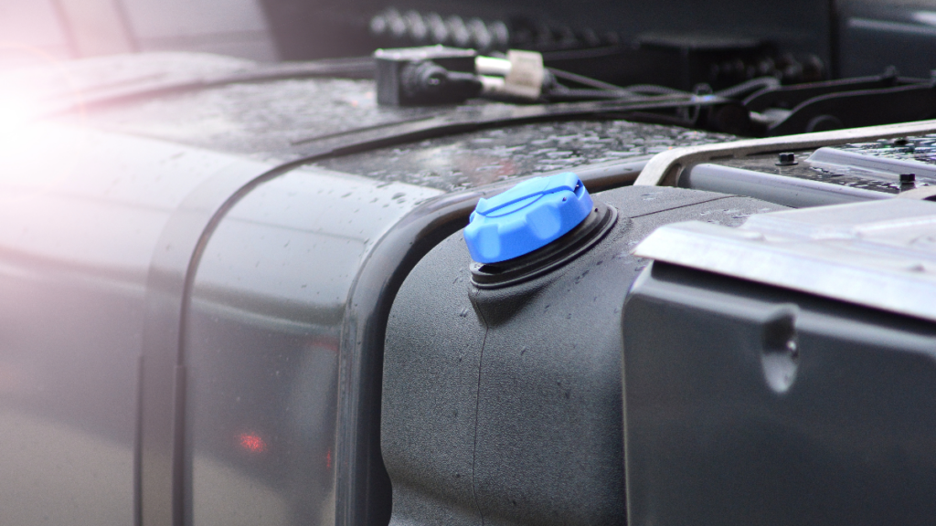 High Density Polyethylene DEF Holding Tank on a Vehicle Next to a Metallic Fuel Tank